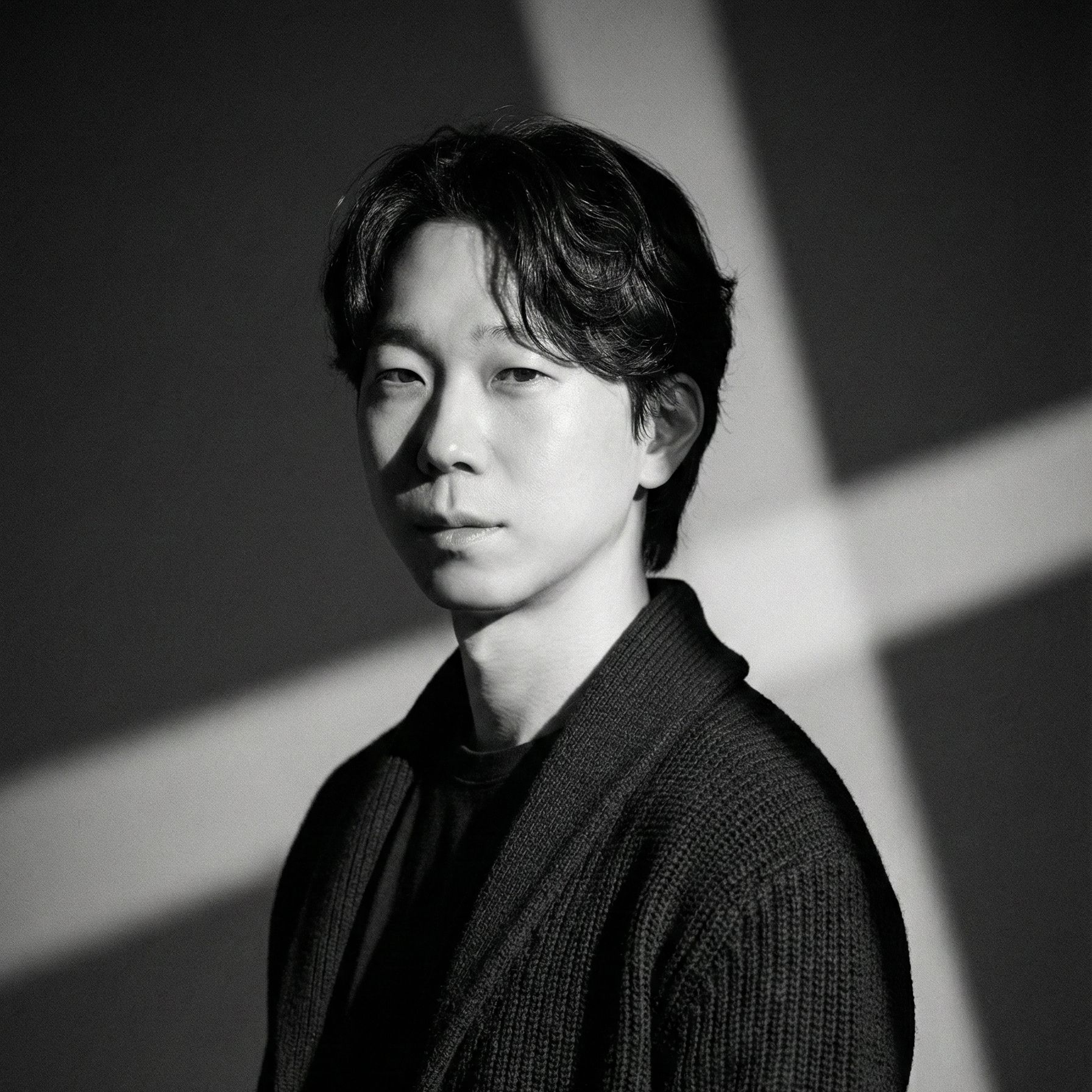 Professional Korean male CEO in his 30s, confident smile, business casual attire, clean studio portrait, professional lighting